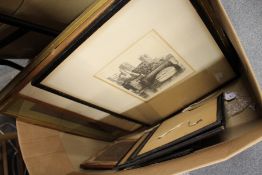 A box of paintings and prints.