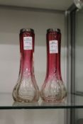 A pair of silver topped pink and clear glass vases.