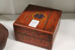A Chinese red lacquer calligraphy box.