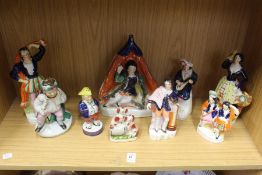 A group of Staffordshire figures.