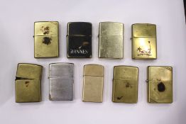 Various Zippo and similar cigarette lighters.