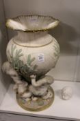 A gilt decorated Parian style jardiniere modelled as 