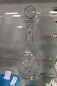 A cut glass decanter.