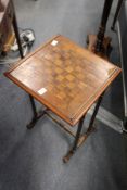 A mahogany and yew wood occasional gaming table with fern inlaid decoration.