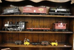 A large plastic model of a tender and various other accessories.