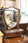 A dressing table mirror.
