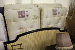 A king size bed with a pair of Staples Mozart mattresses on box bases together with a striped
