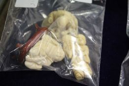 Three Chinese netsukes.