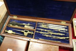 A mahogany drawing instrument set.