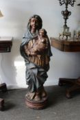 A large impressive carved and polychrome decorated Madonna and Child.