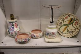 A quantity of Poole pottery and similar china to include lamp bases and bowls.