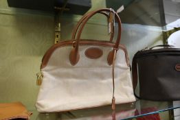 A leather and canvas ladies' handbag. Stamped Hermes.