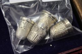 Silver thimbles.