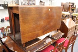A mahogany drop leaf gate leg dining table.