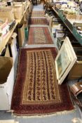 Four small Persian Baluch rugs.