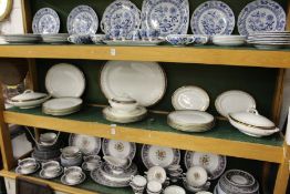 Cauldon china part dinner service, white ground with gilt and blue decorated border.