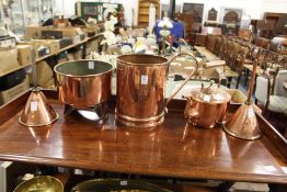 A collection of five copper items to include a kettle, two funnels etc.