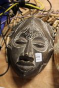 A good carved wood mask with beaded hair.