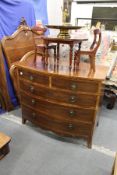 A George III mahogany bowfront chest of two short and three graduated long drawers on splay