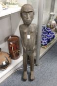 A carved African hardwood standing figure.