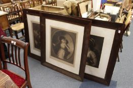 Three large portrait engravings in moulded wooden frames.