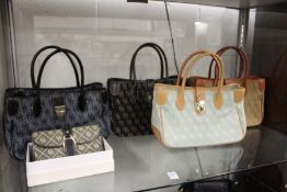 Four Dooney & Bourke handbags and similar purse.
