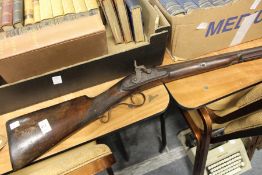 A 19th century percussion shotgun.