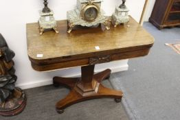 A 19th century rosewood D-shaped foldover card table.