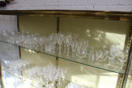 A shelf of cut glass and other drinking glasses.
