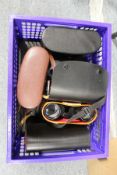 A quantity of cased binoculars.
