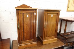 Two Victorian walnut pot cupboards.