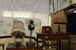 Two lamps, a stationery rack and a book stand.