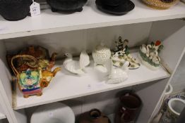 A shelf of decorative china.
