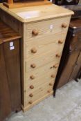 A pine seven drawer chest.