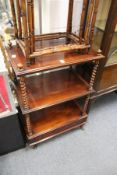 A 19th century mahogany three tier what-not with barley twist columns and a single drawer to the