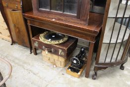 A mahogany side table.