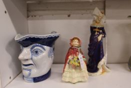 A character mug, a Doulton figurine 'Granny's Shawl' and another 'The Lady Anne Neville'.