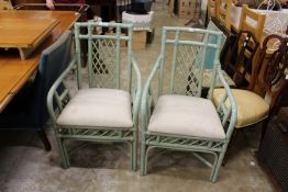 A pair of painted bamboo armchairs.