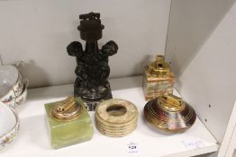 Various table lighters and an ashtray.