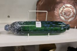 A decorative glass rolling pin.