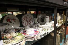 A large quantity of decorative china, a quartz clock, a mirror etc.