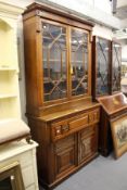 A Victorian walnut secretaire chest with associated bookcase top.
