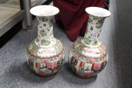 A pair of Chinese famille rose vases.