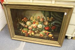 A good large still life of flowers in a basket on a ledge, oil on board, in a decorative gilt
