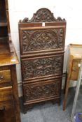 A good carved walnut three door hanging cabinet.