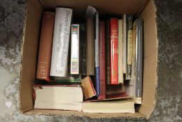 A box of art reference books.