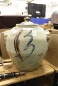 A large studio pottery twin handled jar and cover.