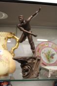 A Royal Doulton model of a cricketer.