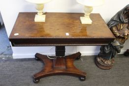 A good 19th century mahogany rectangular foldover card table on a carved column support with