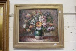 A still life of flowers in a vase, oil on canvas, in a decorative frames.